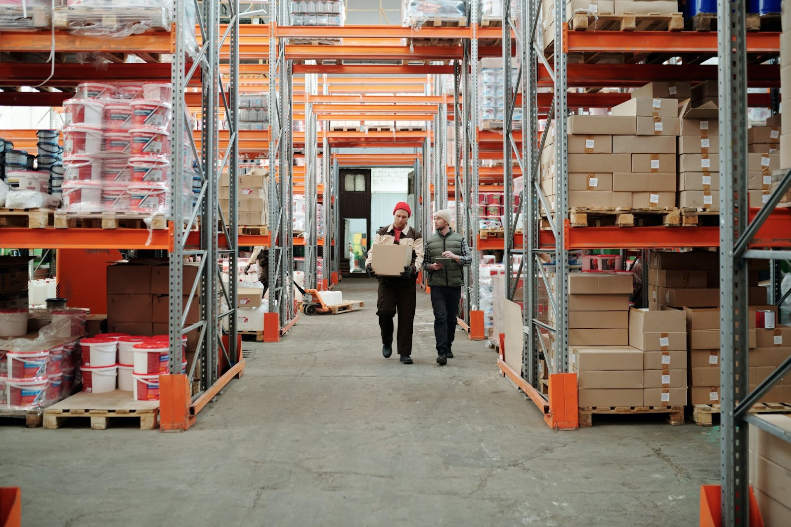 Image of fulfillment center worker and supply chain manager together