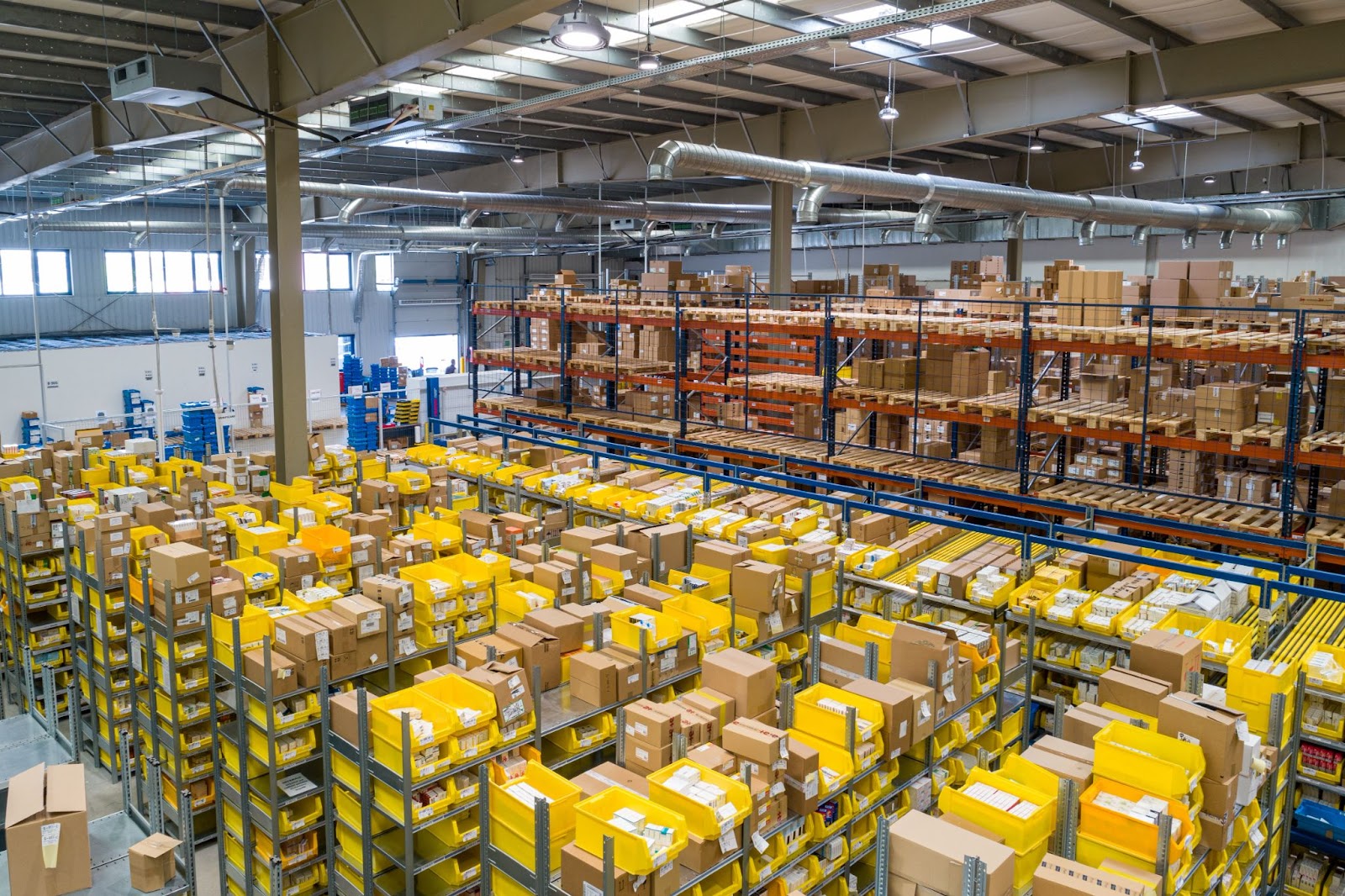 Fulfillment center ith many boxes of separate SKUs stacked on top on one another